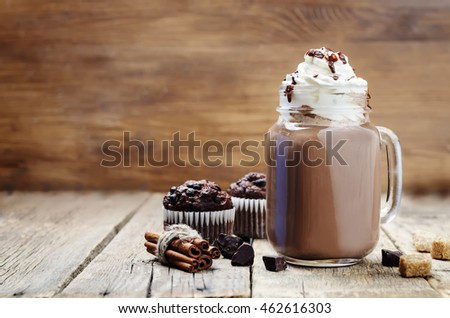 hot dark chocolate with whipped cream. toning. selective focus