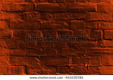 Abstract haunted dark orange and black burnt brick house wall for happy Halloween fright night background or trick or treat party invite flyer