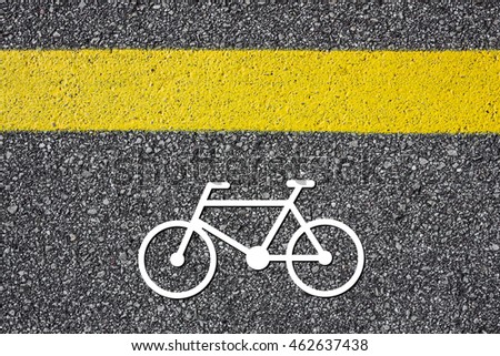 Bicycle logo illustration on asphalt photo.