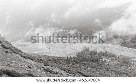 View from the top of Carpathian mountains, above the clouds. Black-white photo