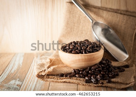 roasted coffee beans on vintage wooden background