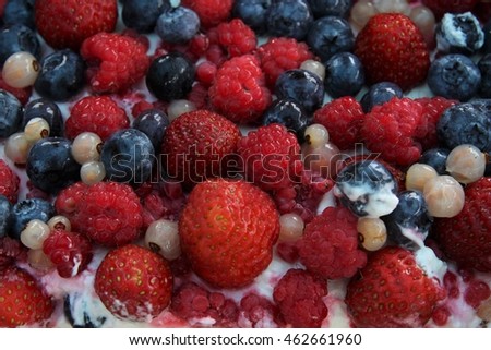 Delicious biscuit cake with fresh strawberries, raspberries, blueberries. Birthday celebration