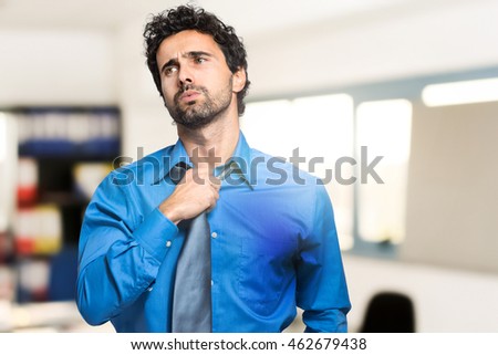 Sweating businessman due to hot climate Royalty-Free Stock Photo #462679438