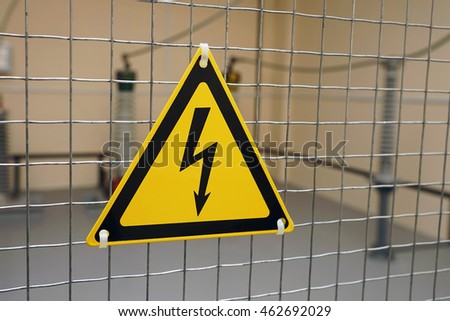 Sign of electrical hazards are yellow with black lightning
