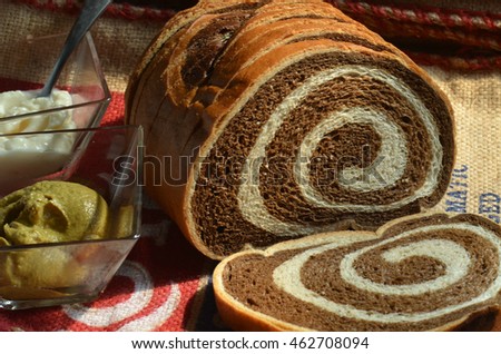 Marble Rye bread slices with side dish of brown mustard Royalty-Free Stock Photo #462708094