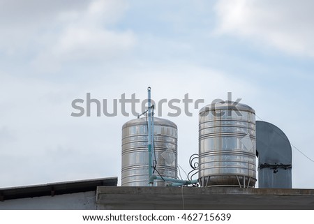 Water towers on a roof of a building