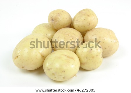Pile fresh mini white potatoes - still life picture.