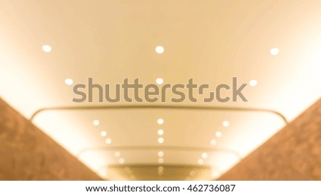 Blurry ceiling of wall for background and frame - warm light tone