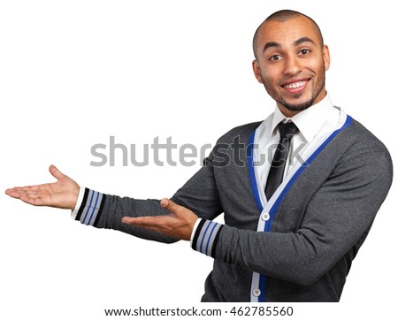 Happy successful businessman pointing on copy space