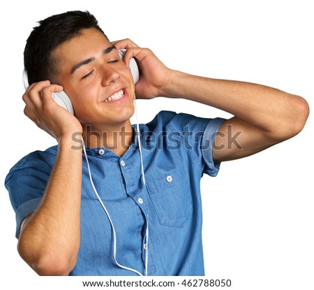 portrait of a young man listening to music with headphones