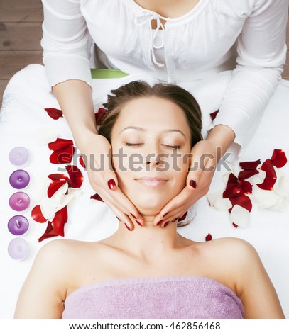 stock photo attractive lady getting spa treatment in salon, massage doctor smiling care pretty
