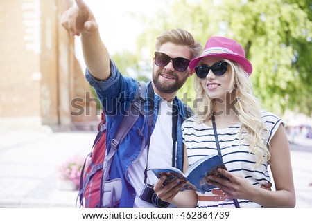 Tourists with map at the city 