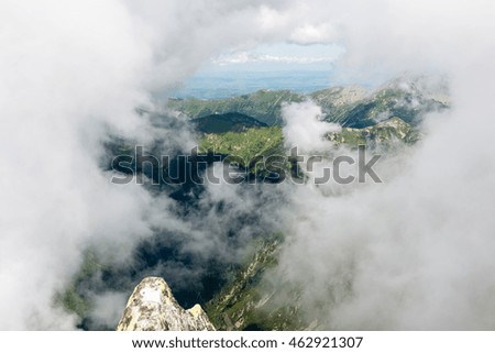rocky mountain landscape covered with clouds and fog. High Tatra, Slovakia