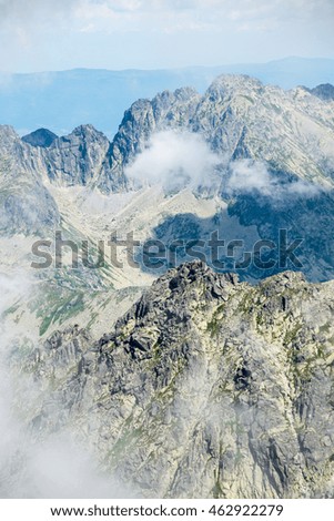 rocky mountain landscape covered with clouds and fog. High Tatra, Slovakia