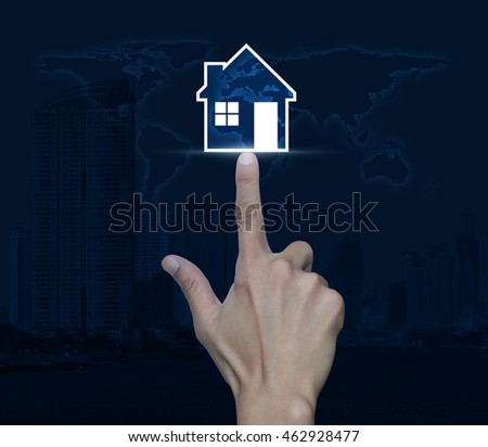 Hand pressing house icon over map and city tower, Real estate concept, Elements of this image furnished by NASA