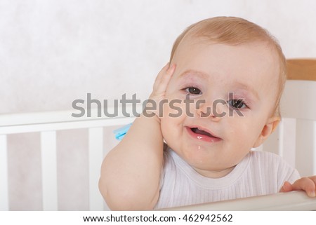 A baby girl suffers from gum pain. Closeup Royalty-Free Stock Photo #462942562
