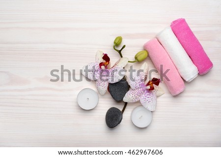 SPA theme with aromatic candles, orchid flower and towel
