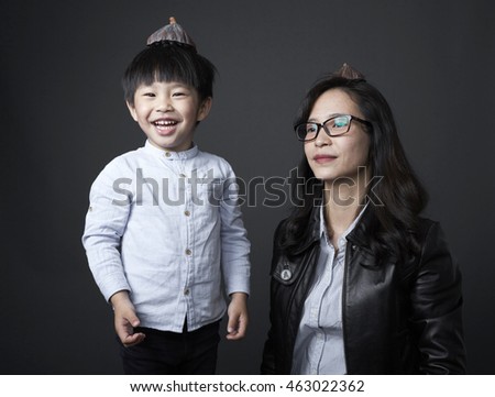 Asian Chinese child and mother,happiness playing,shot in studio
