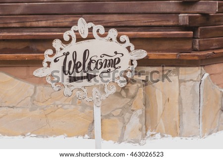 Handmade wooden board with welcome sign. Wedding. Reception.