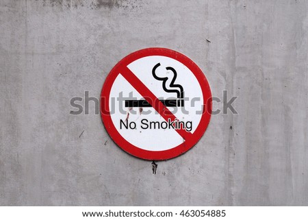 No Smoking Sign on cement wall
