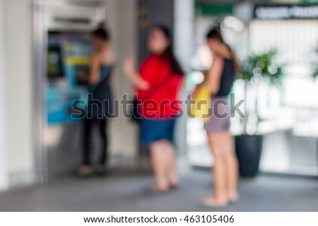 Abstract Blurred, Women line up to buy train Tickets.