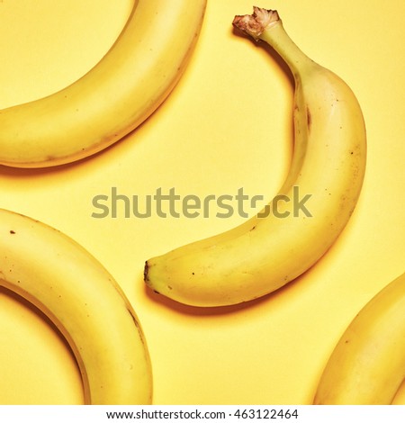 Minimalism conception: banana on yellow background. Top view. Flat lay