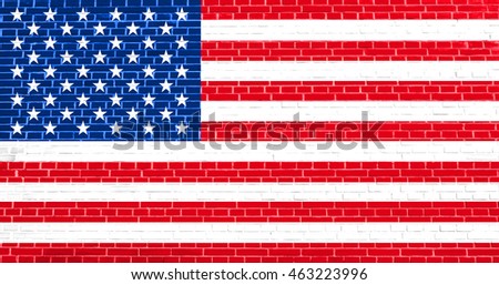 Flag of the United States on brick wall texture background. American national flag.