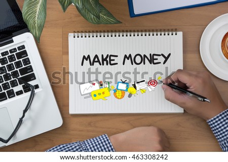 MAKE MONEY MAKE MONEY man hand notebook and other office equipment such as computer keyboard