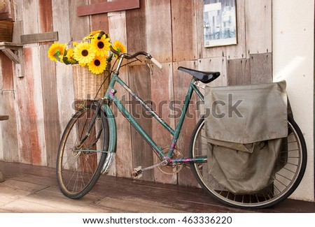 Vintage bicycle with flower - vintage effect filter style pictur