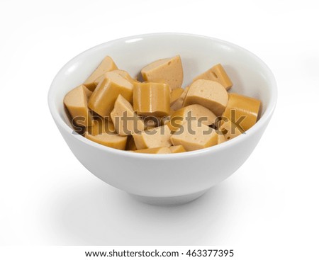Diced boiled sausage in white ceramic bowl with nice smooth clipping path attached.Isolated image of sausage or ham in white ceramic bowl with clipping path. Clipping path editable picture.