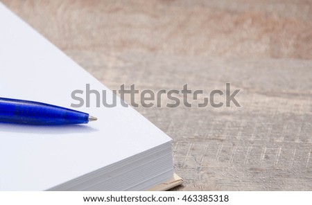 pen on book