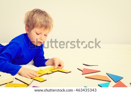 early education -little boy playing with puzzle