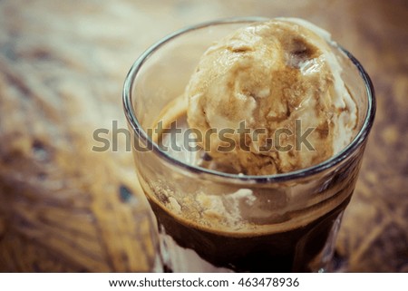 Affogato coffee, espresso shot with vanilla ice cream, background concept.