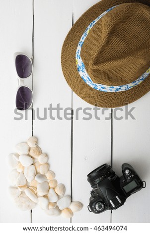 Beach accessories on wooden board. Summer vacation