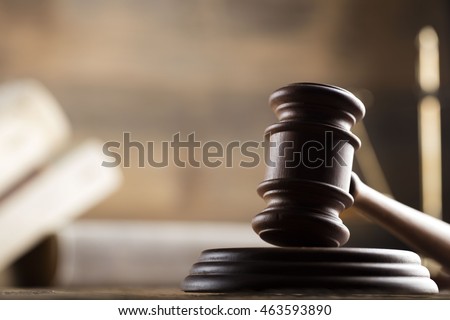 law theme, mallet of the judge, wooden desk, scales of justice, books, statue of justice and hourglass Royalty-Free Stock Photo #463593890