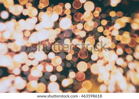 abstract blurred and silver glittering shine bulbs lights background:blur of Christmas wallpaper decorations concept.holiday festival backdrop:sparkle circle lit celebrations display