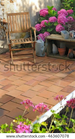patio flowered with terracotta tiles 