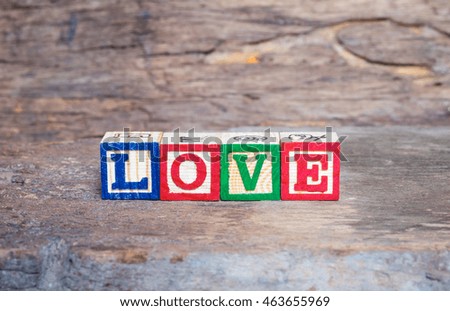 Love message written in wooden blocks on the old wood
