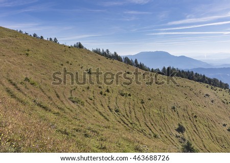 Vast meadow with mountain Golte in background, Slovenia