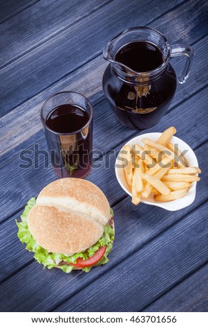 juice, a hamburger and fries on the table