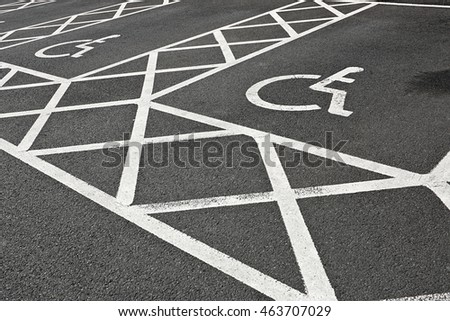 Designated Disabled car parking spaces reserved with white painted lines often set aside to give handicapped people accessibility in a car park.