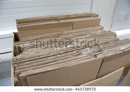 Stacking used cardboard box for recycling

