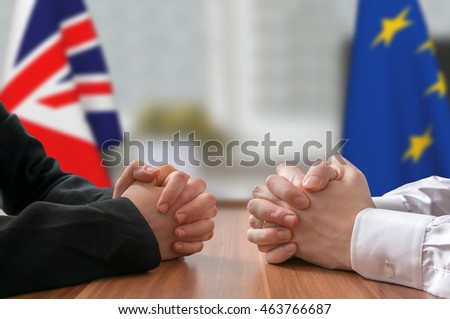 Negotiation of Great Britain and European Union (Brexit). Statesman or politicians with clasped hands. Royalty-Free Stock Photo #463766687