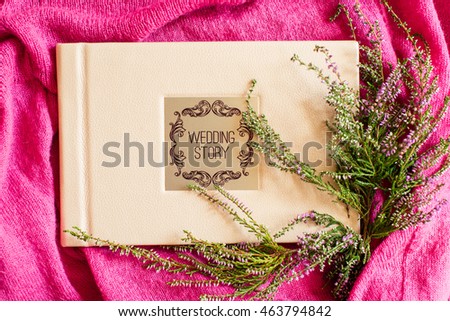 Wedding photobook on a pink background