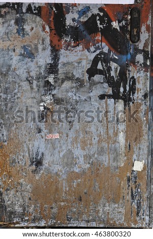 Graffiti on a rough textured city wall background
