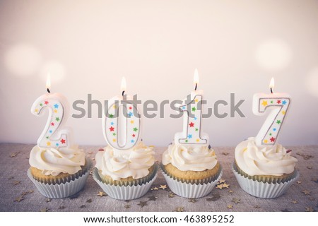 2017 Happy New Year Cupcakes with fairy light toning background Royalty-Free Stock Photo #463895252