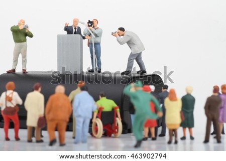 miniature figurine of a politician speaking to the crowd during an election