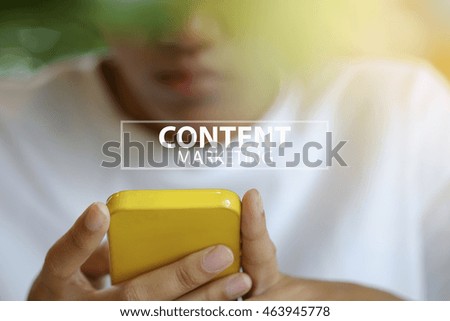 Woman using smartphone or mobile phone with CONTENT MARKETING text