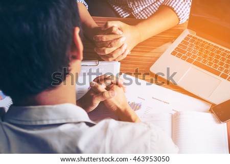 Interview or dialogue between businessman with clasped hands in the office.