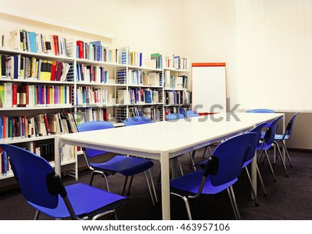 Modern library interior with blue chairs